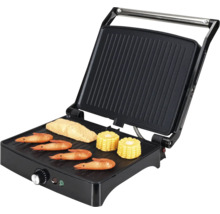 Gril de contact avec crevette, poisson et maïs sur la surface de cuisson