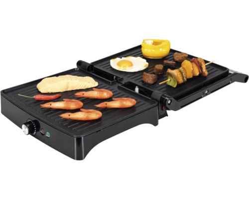 Gril de table électrique avec poisson, crevettes, légumes et brochette.