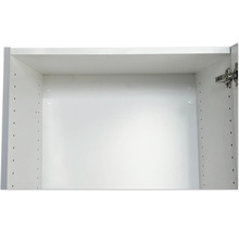 Intérieur d'un meuble de cuisine blanc avec des trous pour des étagères réglables