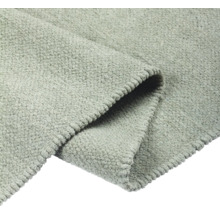 Detailansicht eines grauen Teppichs mit Textur