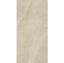 Gros plan d'un carreau de sol beige avec une finition mate.