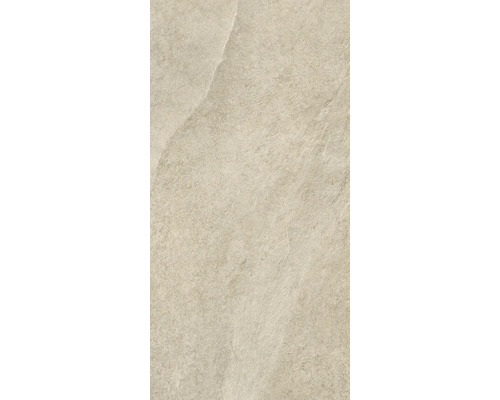 Gros plan d'un carreau de sol beige avec une finition mate.