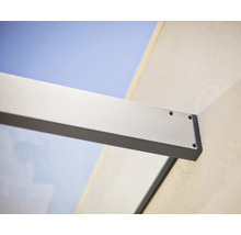 Fixation murale d'un support d'auvent en verre en aluminium avec vis apparentes.