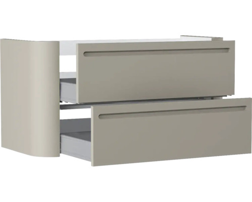 Waschtischunterschrank mit zwei leicht geöffneten Auszügen, integrierten Griffmulden und abgerundeter Seitenwand in Taupe.