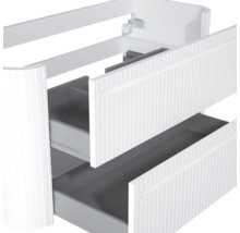 Waschbeckenunterschrank mit zwei Schubladen, vertikalem Rillendesign an der Front und abgerundeten Ecken.