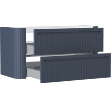 Blauer Waschbeckenunterschrank mit zwei Auszügen, geriffelter Front und abgerundeter Ecke.