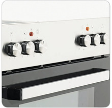 Vue détaillée d'une cuisinière avec boutons rotatifs pour contrôler les plaques de cuisson et les fonctions du four