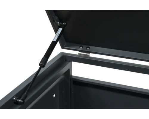 Detailansicht einer Metallbox mit Gasdruckfeder zur Deckelstützung