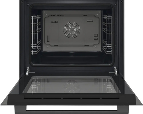 Vue intérieure d'un four avec porte ouverte.