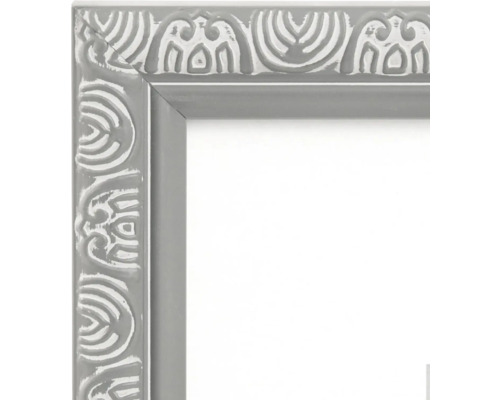 Coin d'un cadre photo gris avec des ornements