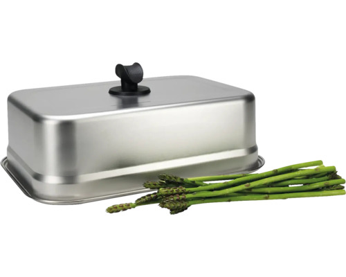 Cloche de cuisson rectangulaire en acier inoxydable avec poignée noire et asperges vertes fraîches.
