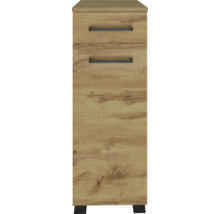 Armoire étroite aspect chêne avec un tiroir, une porte et des poignées noires.