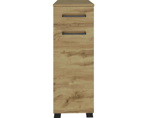 Armoire étroite aspect chêne avec un tiroir, une porte et des poignées noires.