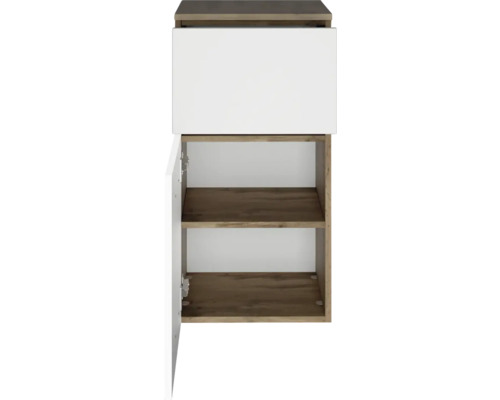 Meuble bas de salle de bains aspect chêne avec un tiroir blanc et une porte ouverte, deux étagères.