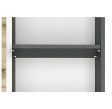Gros plan d'une tablette gris anthracite dans un meuble avec des parois intérieures blanches et des supports métalliques.