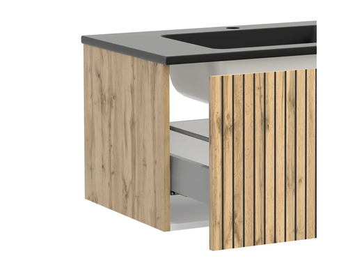 Moderner Waschtischunterschrank mit Holzlamellen-Front, dunkelgrauem Waschbecken und Einblick in das offene Schubladensystem.