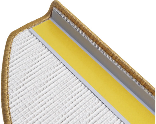 Détail d'une contremarche de tapis avec bande de fixation