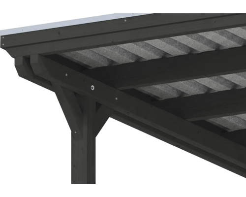 Vue détaillée d'un raccord d'angle d'un abri de voiture en bois foncé avec un toit en tôle trapézoïdale.