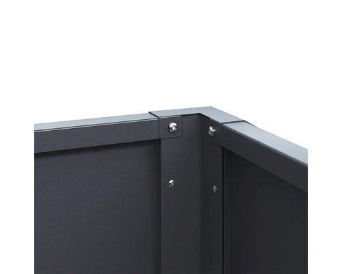 Raccord d angle d un bac à plantes en métal avec vis apparentes.