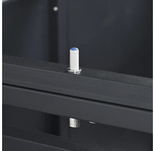 Amortisseur de butée blanc avec pointe bleue sur un cadre métallique gris foncé.