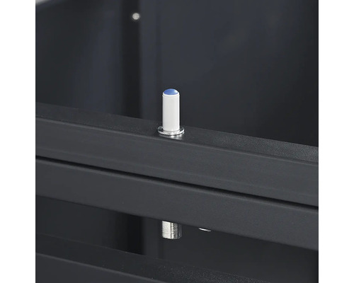 Amortisseur de butée blanc avec pointe bleue sur un cadre métallique gris foncé.