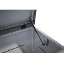 Détail du vérin à gaz sur un coffre de jardin en métal pour faciliter l'ouverture et le maintien du couvercle.