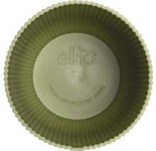 Vue de dessus dans un pot de fleurs rond elho en plastique recyclé avec paroi rainurée et elho Logo.