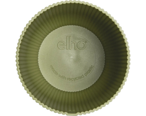 Vue de dessus dans un pot de fleurs rond elho en plastique recyclé avec paroi rainurée et elho Logo.