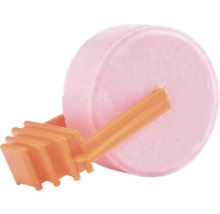 Runder rosa Toiletten-Duftstein mit einem orangefarbenen Kunststoffhalter.