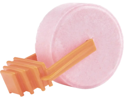 Runder rosa Toiletten-Duftstein mit einem orangefarbenen Kunststoffhalter.