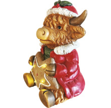 Figurine de Noël vache Highland avec bonnet de Noël, manteau rouge et étoile en pain d'épices lumineuse.