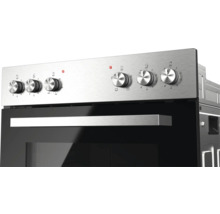 Panneau de commande d'un four encastrable en acier inoxydable avec six boutons rotatifs et une poignée.