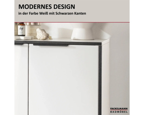 Meuble de salle de bain Fackelmann au design moderne blanc avec bordures et poignées noires. Logo Fackelmann Badmöbel.