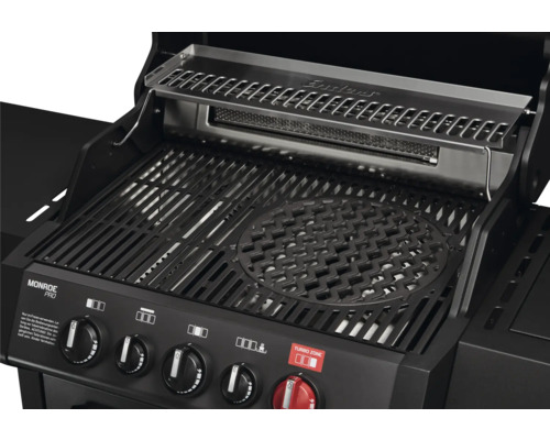 Gros plan d un barbecue à gaz Enders Monroe Pro avec grille en fonte, système Switch Grid, grille de maintien au chaud en acier inoxydable.