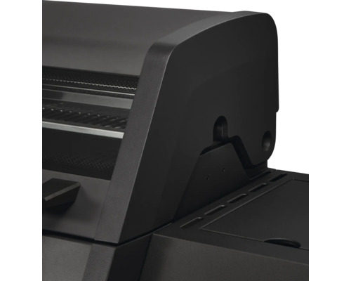 Vue détaillée du couvercle noir et de la charnière de la tablette latérale d'un barbecue à gaz.