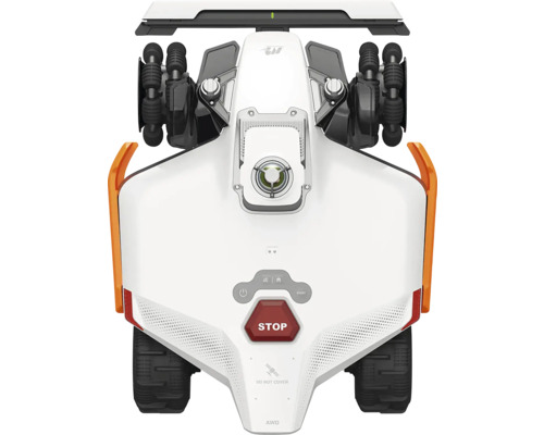 Vue de dessus d'un robot tondeuse blanc avec quatre roues motrices, pneus noirs et bouton d'arrêt rouge.