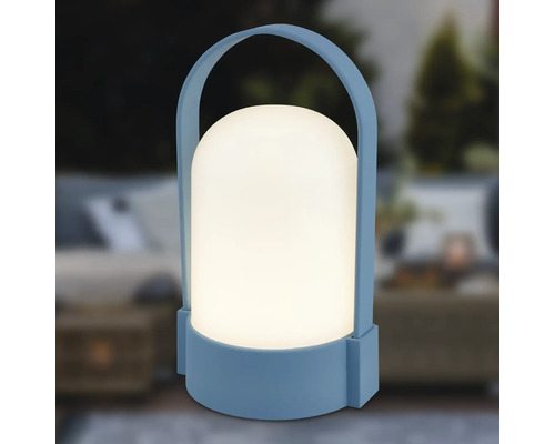 Lampe extérieure LED portable bleue avec abat-jour blanc arrondi et poignée de transport.