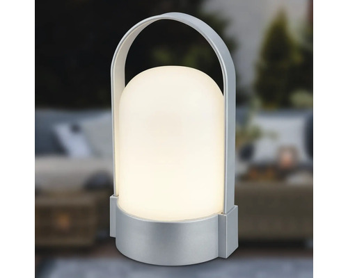Lampe de table à LED portable avec socle et poignée en étrier de couleur argentée, abat-jour en forme de dôme, lumière blanc chaud.