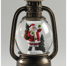 Schneekugel in Form einer antiken Laterne mit Weihnachtsmann-Figur und Tannenbäumen im Inneren.