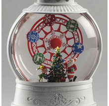 Boule à neige de Noël avec grande roue, sapin, Père Noël et elfe sur socle blanc.