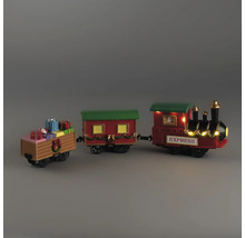 Train de Noël décoratif avec locomotive, wagon et wagon de cadeaux, orné de guirlandes et éclairage blanc chaud.