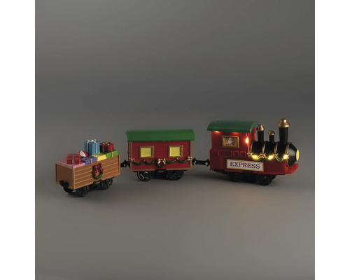 Train de Noël décoratif avec locomotive, wagon et wagon de cadeaux, orné de guirlandes et éclairage blanc chaud.