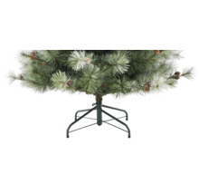 Künstlicher Weihnachtsbaum mit Kiefernzapfen und Schneeoptik auf einem Metallständer.