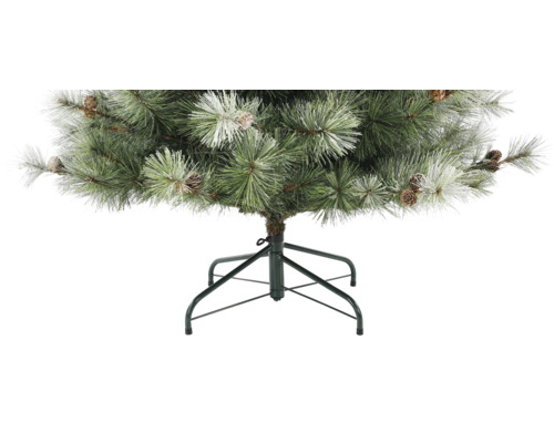 Künstlicher Weihnachtsbaum mit Kiefernzapfen und Schneeoptik auf einem Metallständer.
