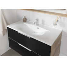 Meuble sous-vasque moderne avec façade foncée, côtés en aspect bois, vasque en céramique blanche et robinetterie chromée.