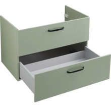 Meuble sous-vasque vert clair avec deux tiroirs et poignées noires, le tiroir inférieur est ouvert.