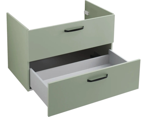 Meuble sous-vasque vert clair avec deux tiroirs et poignées noires, le tiroir inférieur est ouvert.