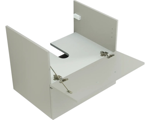 Vue intérieure d un corps de meuble sous-lavabo gris clair avec découpe pour siphon dans le fond et abattant ouvert avec charnières métalliques.