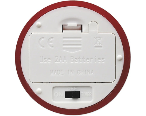 Unterseite eines batteriebetriebenen Geräts mit rotem Rand, Batteriefach für zwei AA-Batterien und Schalter für Ein, Aus und Timer.