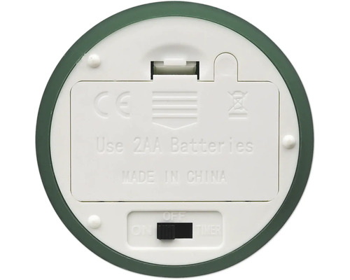 Unterseite eines Geräts mit Batteriefach für zwei AA-Batterien und Schalter mit Ein-, Aus- und Timer-Funktion sowie CE-Kennzeichnung.